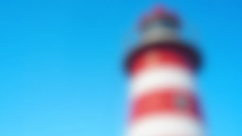 Close-up detail of red and white striped lighthouse tower showing architectural features and paint pattern against blue sky